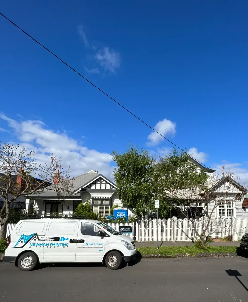 Exterior painting job with company van.